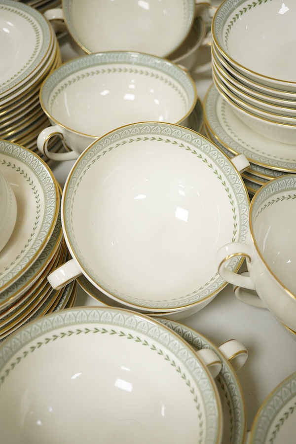 A Royal Doulton Berkshire pattern part dinner service to include tureens, twin handled cups and oval platters, largest 33cm wide. Condition - mostly good
